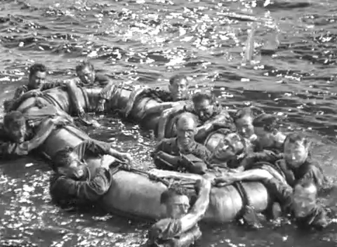 Survivors by a life raft in In Which We Serve (1942)