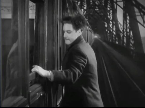 Robert Donat on a train in Alfred Hitchcock's  The 39 Steps (1935)